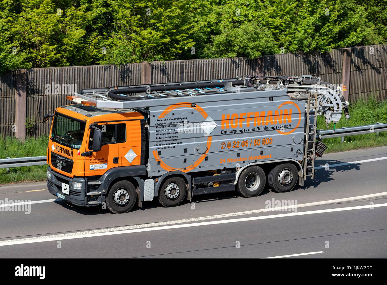 Hoffman MAN sewer cleaning truck on motorway Stock Photo