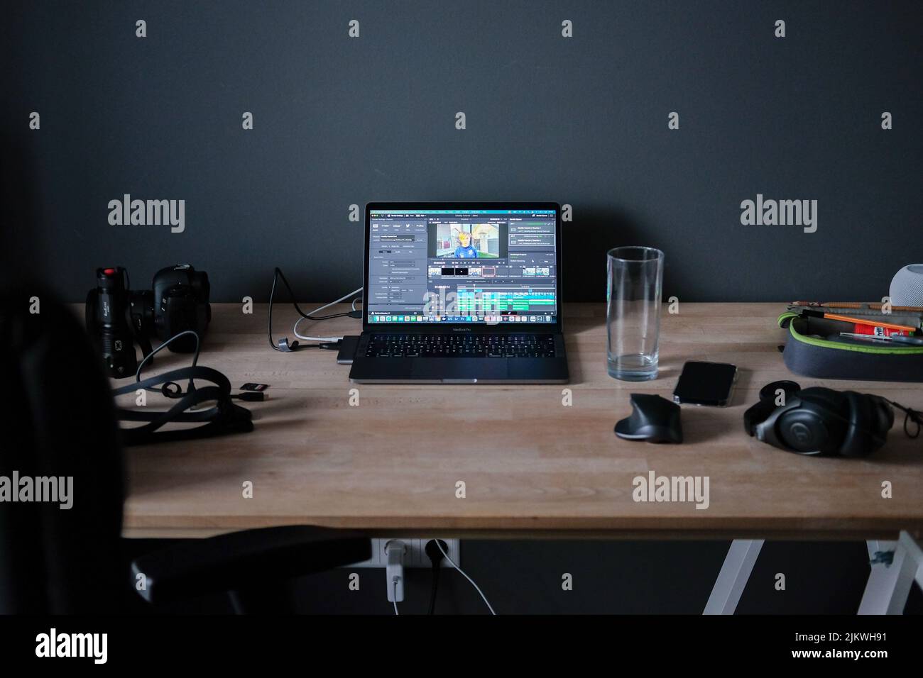 A working desk with a laptop doing content creation in Germany Stock Photo