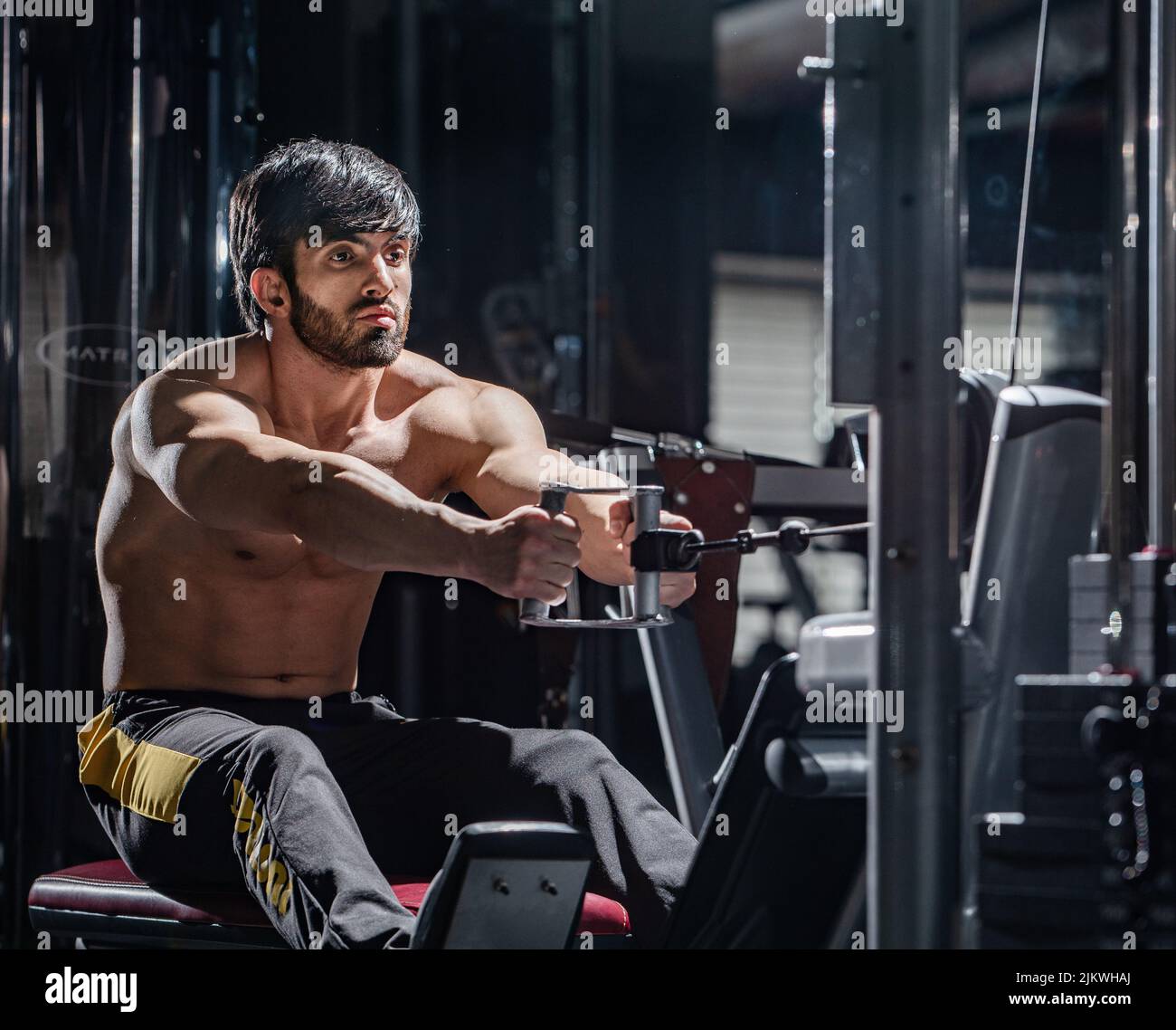 A fit athletic muscular Caucasian man working out at the gym Stock Photo