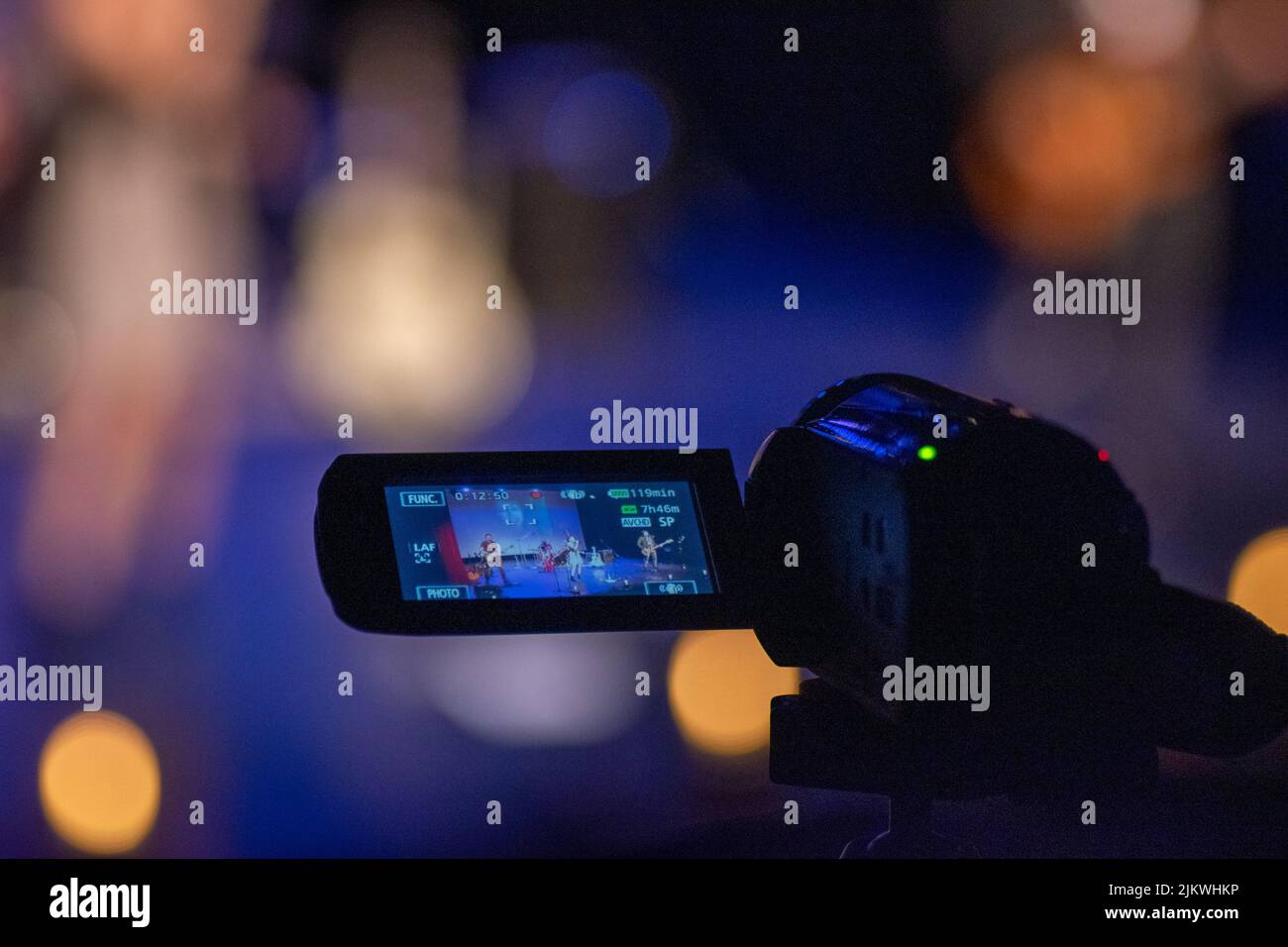 A selective focus shot of a recording video camera against a bokeh background Stock Photo