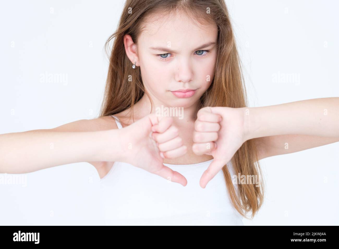 emotion discontent dissatisfied child thumbs down Stock Photo