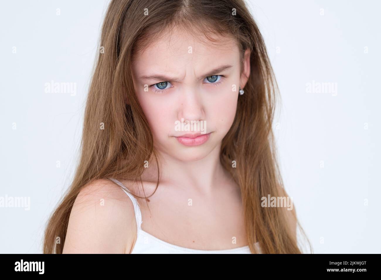 emotion grumpy unhappy discontent frowning child Stock Photo