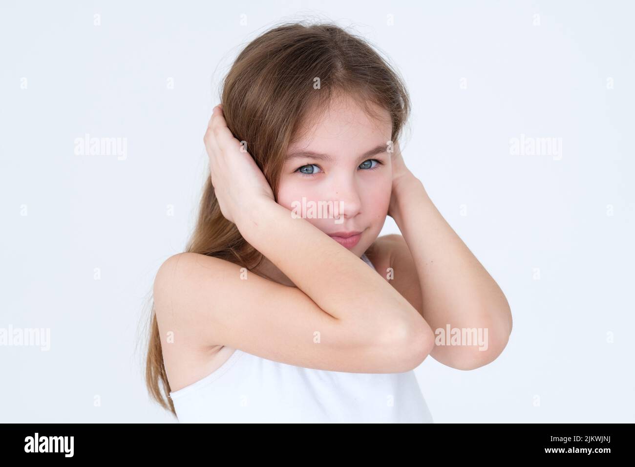 child covering ears hands disobedience naughtiness Stock Photo