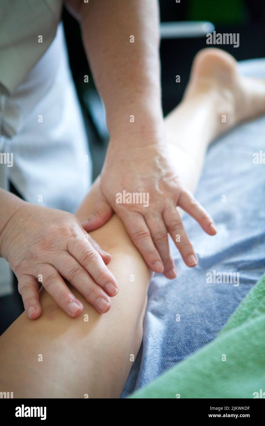Manual lymphatic drainage performed by a doctor. Stock Photo