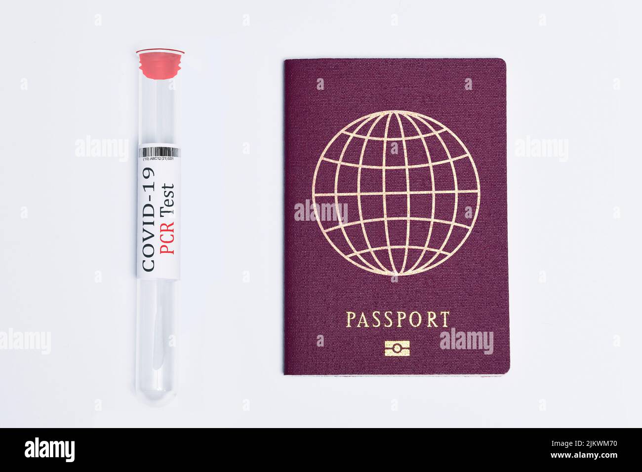 A closeup of a nasal swab and a travel passport isolated on a white background Stock Photo