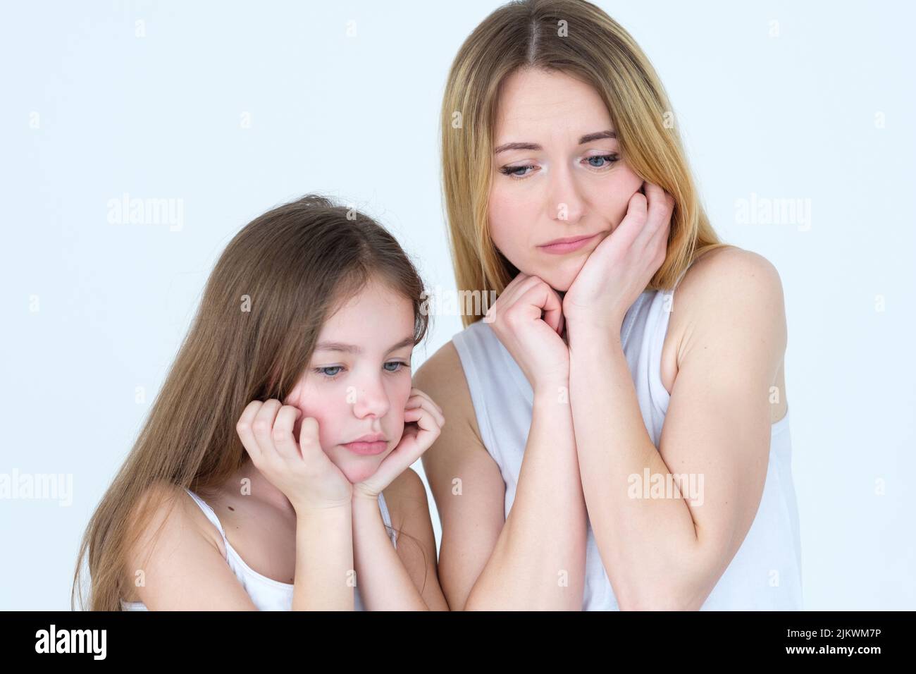 sad pensive mother daughter waiting missing family Stock Photo