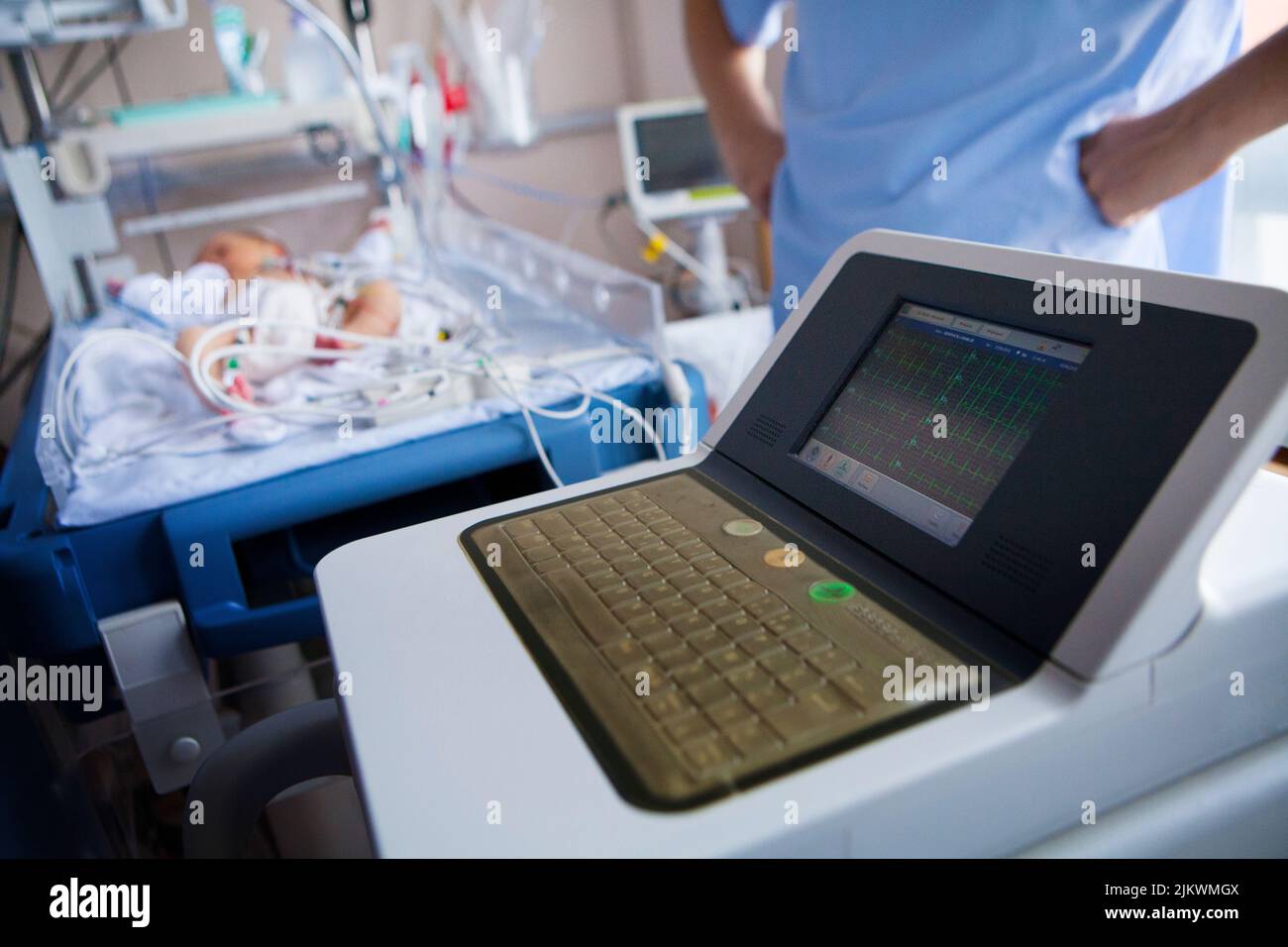 A premature newborn with abnormal heart rhythms has an ECG. Stock Photo