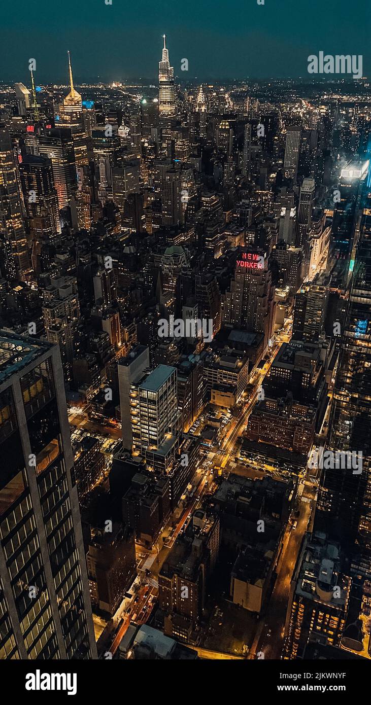 A vertical shot of a New York city with neon lights during the night Stock Photo