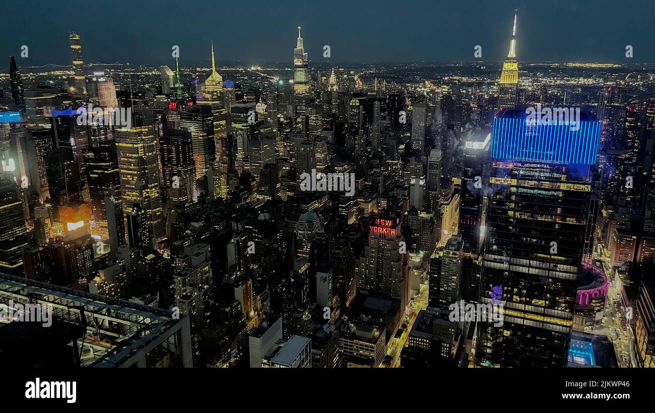 An aerial shot of a New York city with neon light during the night Stock Photo