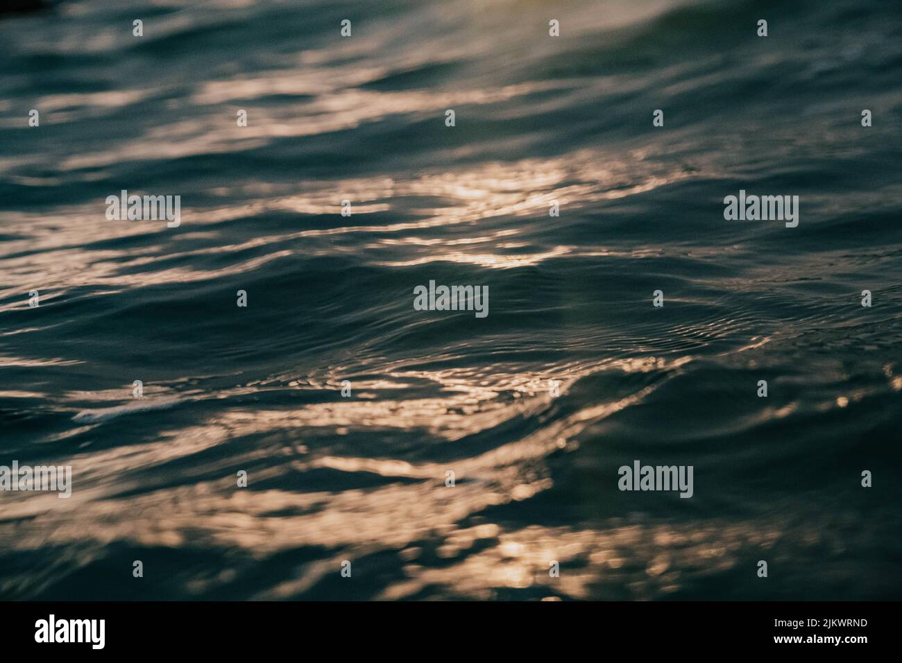 A closeup of a sea surface with reflection of sunlight Stock Photo - Alamy