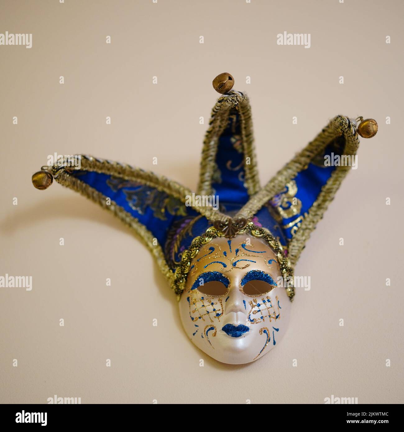 A colorful carnival mask hanging on a wall Stock Photo Alamy