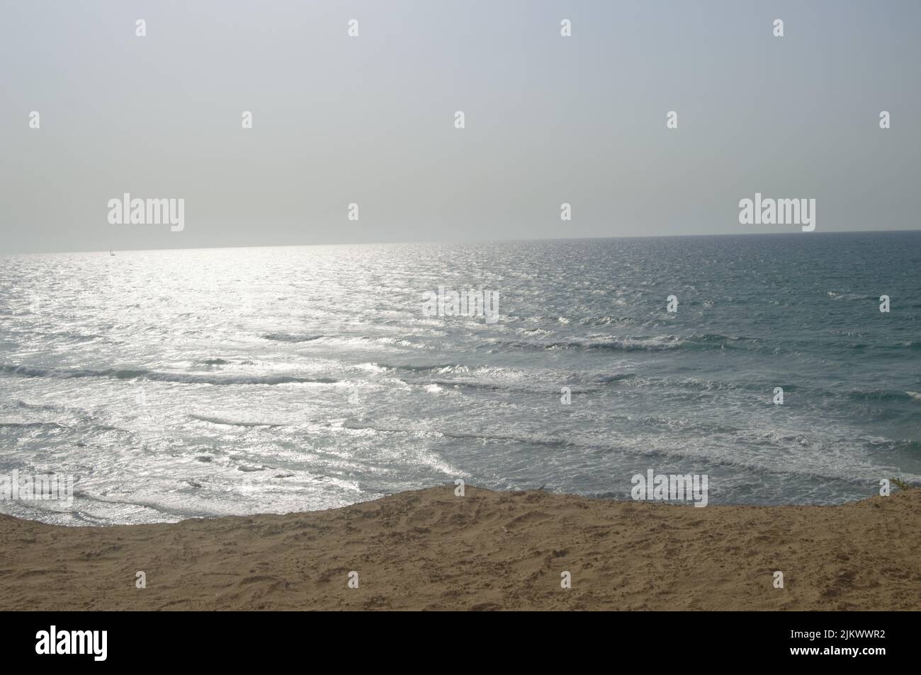 Sandy beach sea in daytime hi-res stock photography and images - Alamy