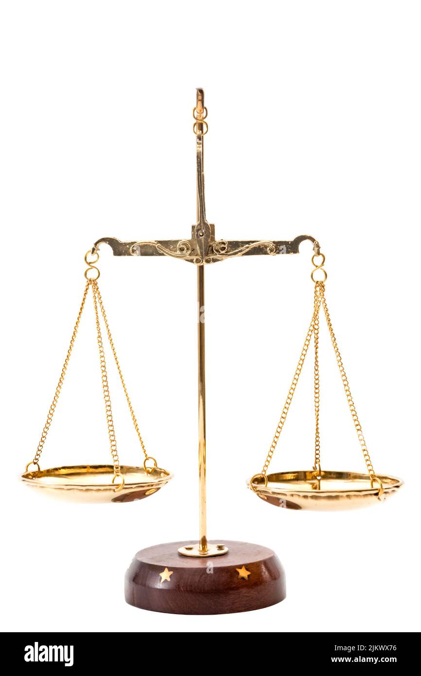 Gold balance scales with metallic chains and wood base used to compare weights, isolated on white background with clipping path cutout concept for leg Stock Photo