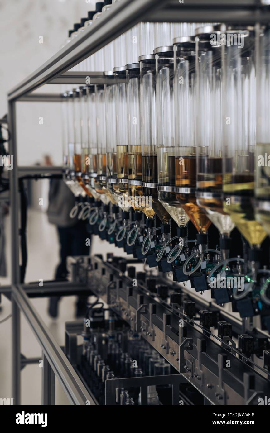 A Vertical Shot Of Types Of The Perfume Manufacturing Containers In A 