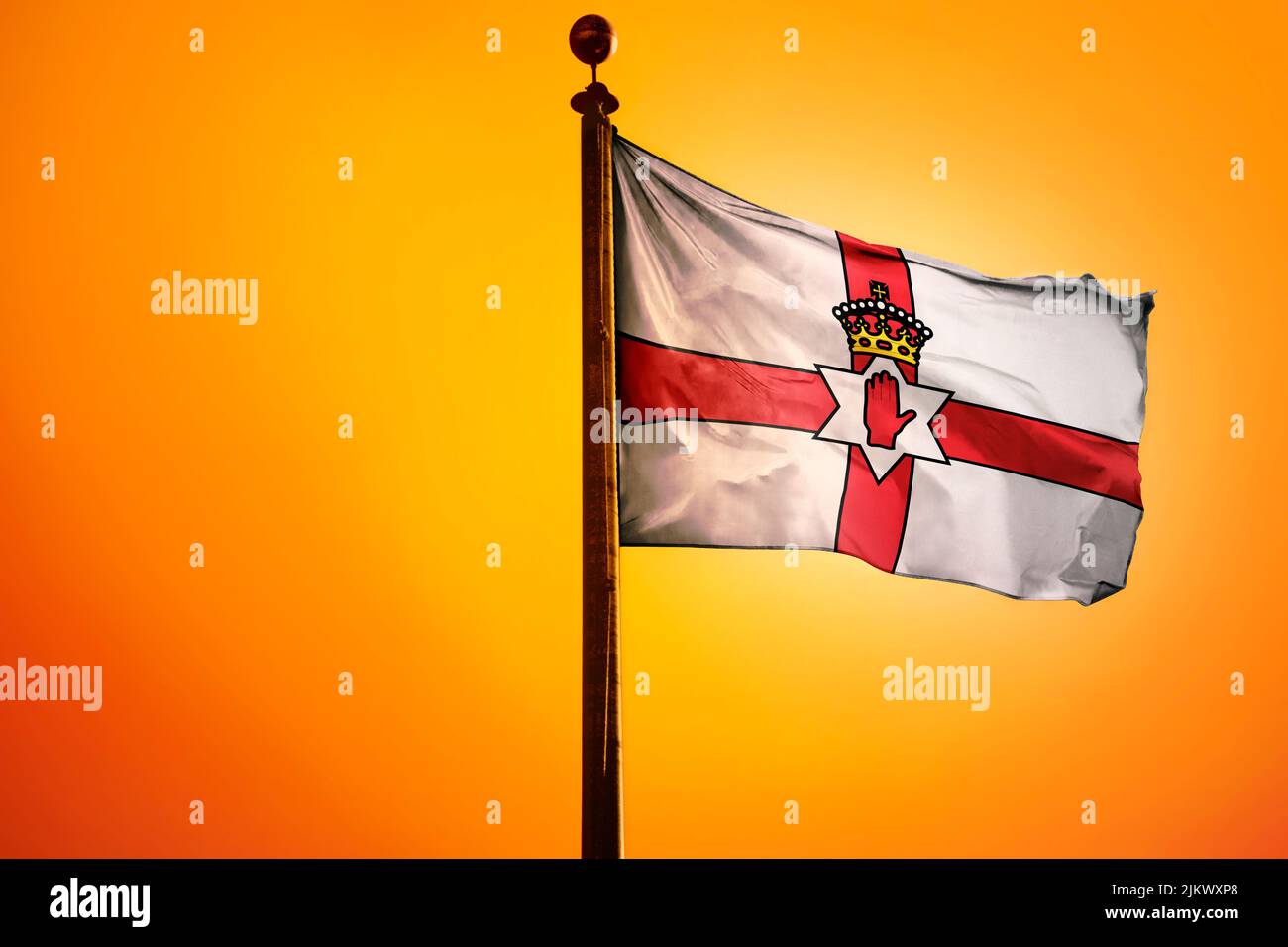 The national flag of Northern Ireland on a flagpole isolated on an ...