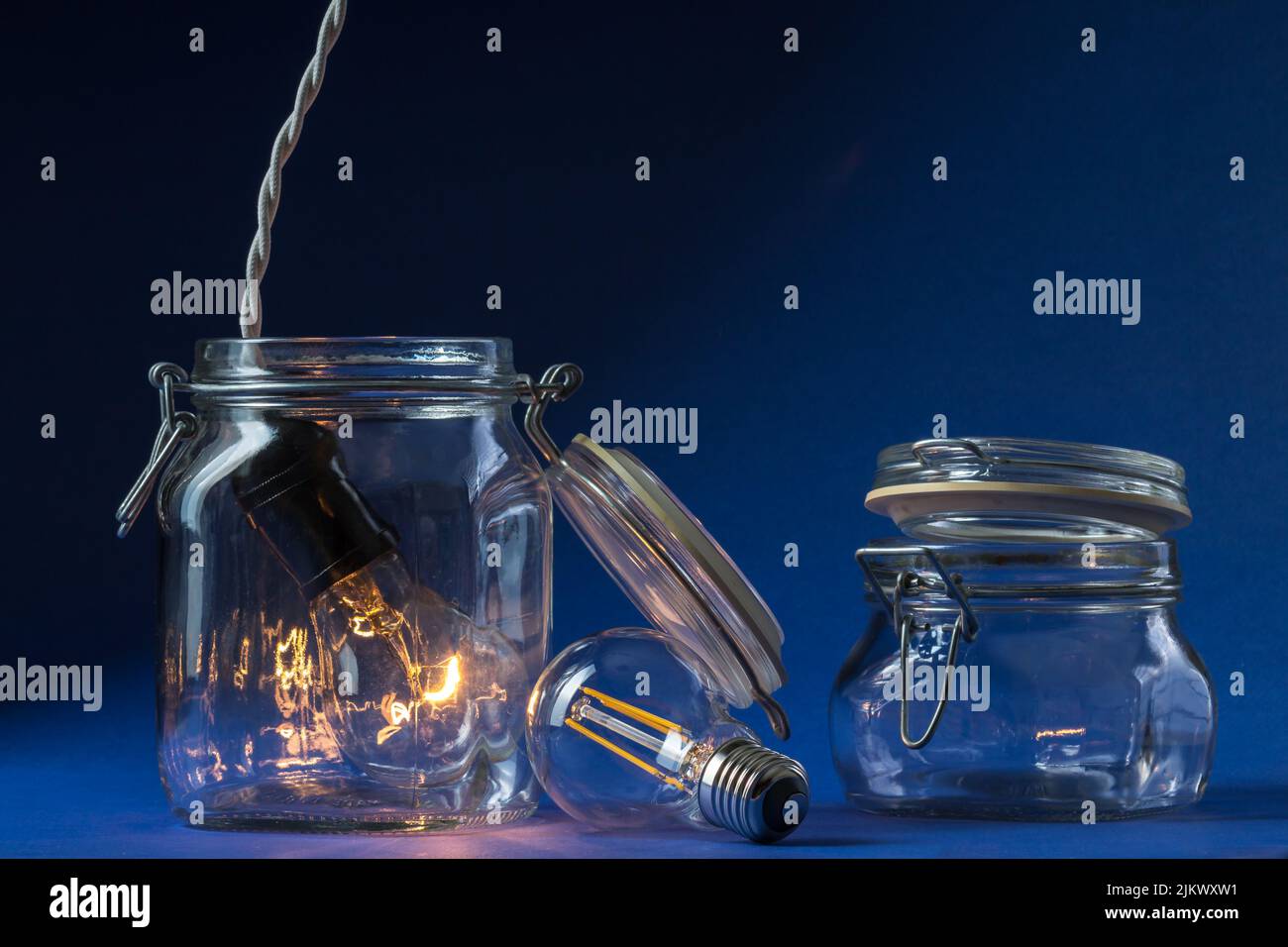 Incandescent bulb turned on, it is stored in a glass jar and replaced