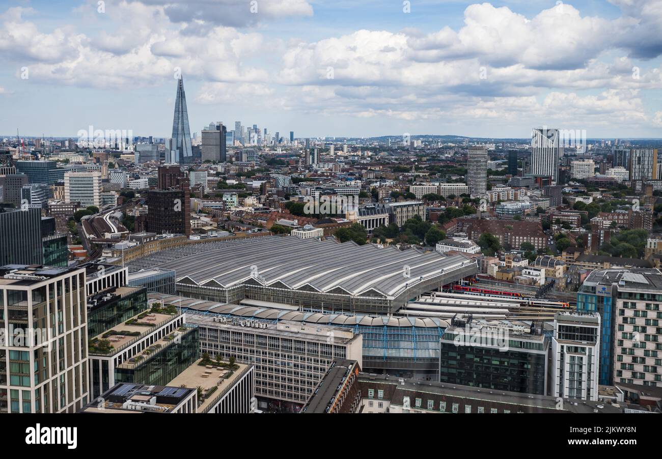 Looking down on Waterloo train station from the London Eye in August 2022.  The Shard and further back still Canary Wharf can be seen in the backgroun Stock Photo