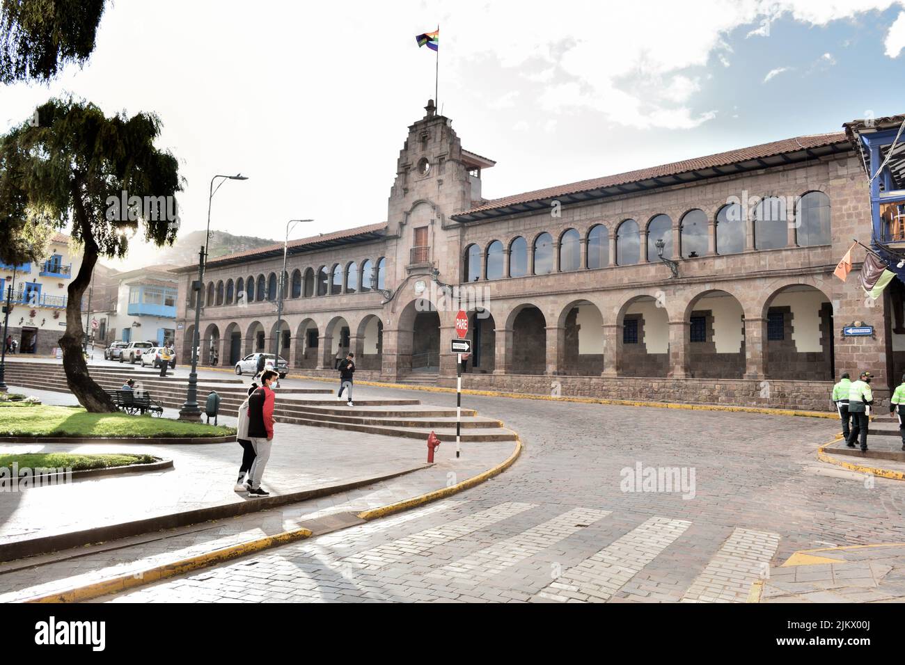 A beautiful shot of people walking against the Government House in the Cusco, Peru Stock Photo