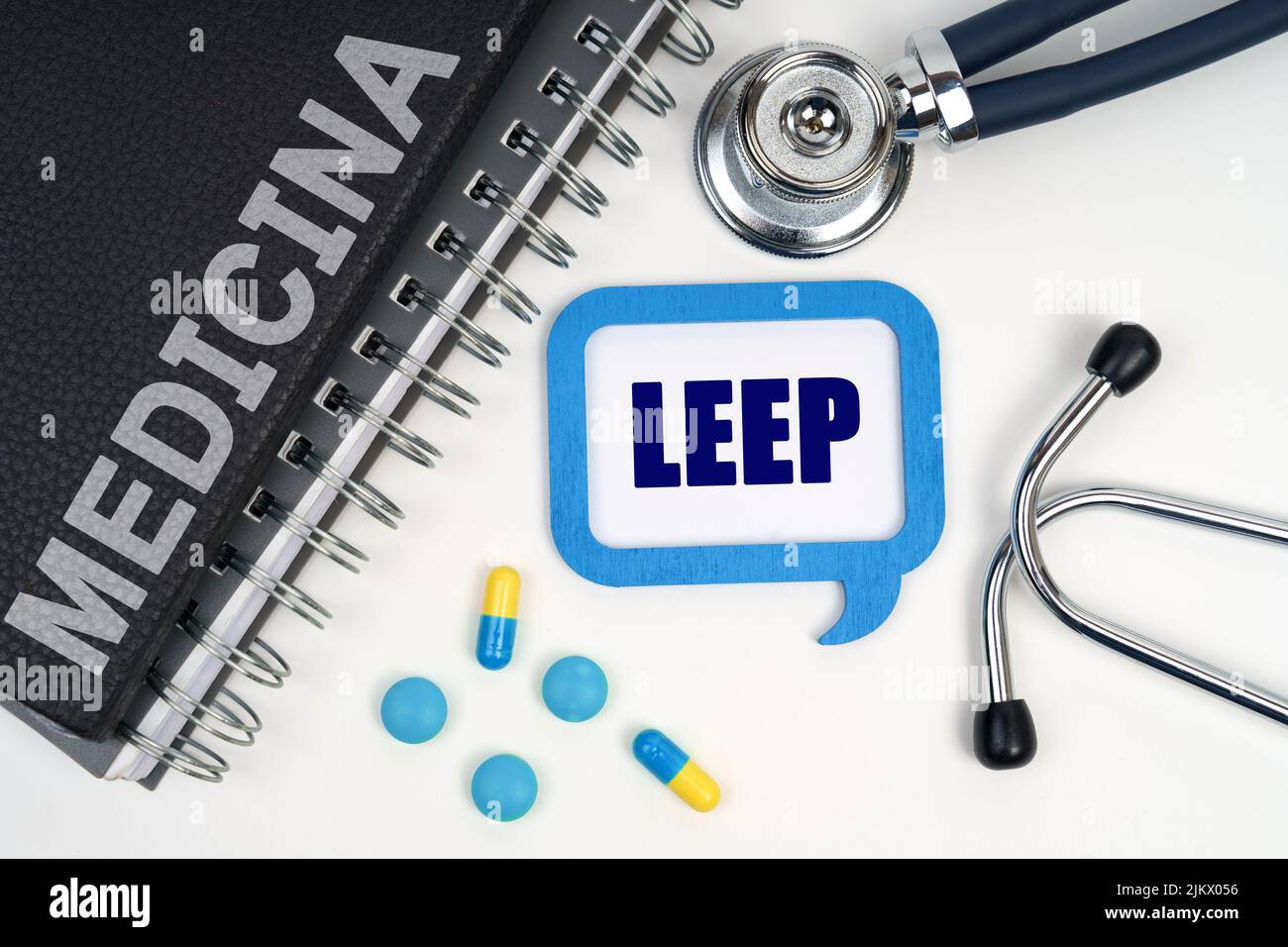 Medicine and health concept. On the table is a stethoscope, a diary and a sign with the inscription - LEEP Stock Photo