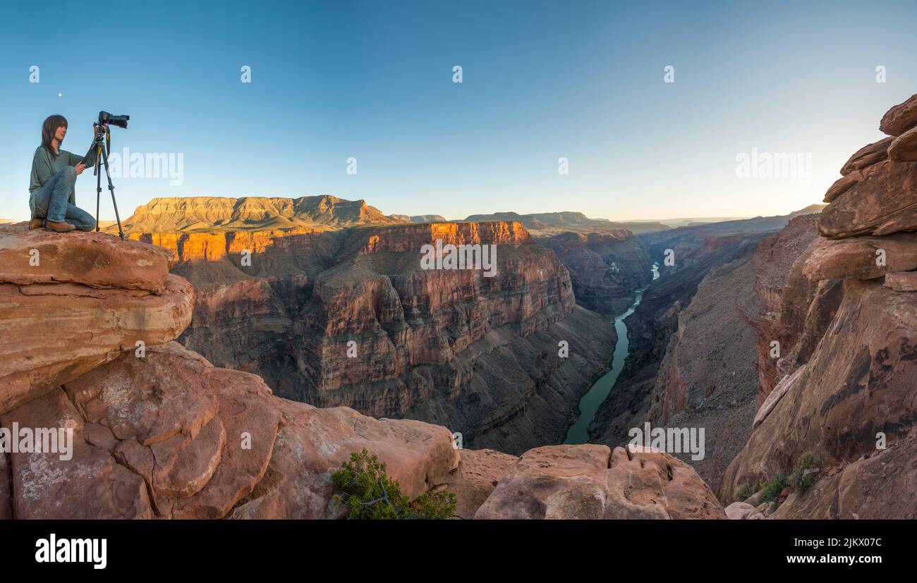 Photographer overlooking Colorado River at Toroweap, Grand Canyon National Park Arizona USA Stock Photo