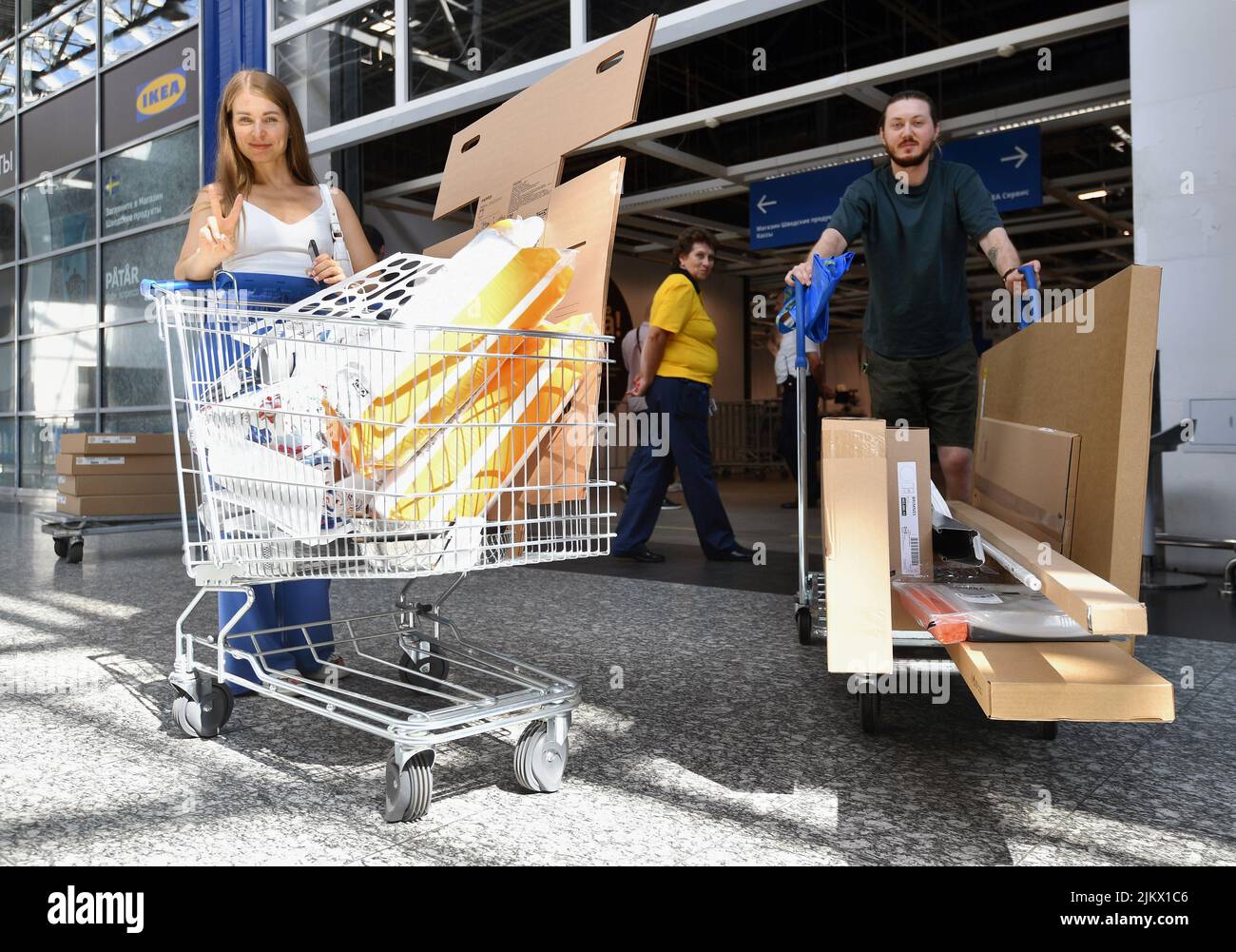 Pickup point of orders in the store IKEA "Belaya Dacha". Genre photography. Man and woman with