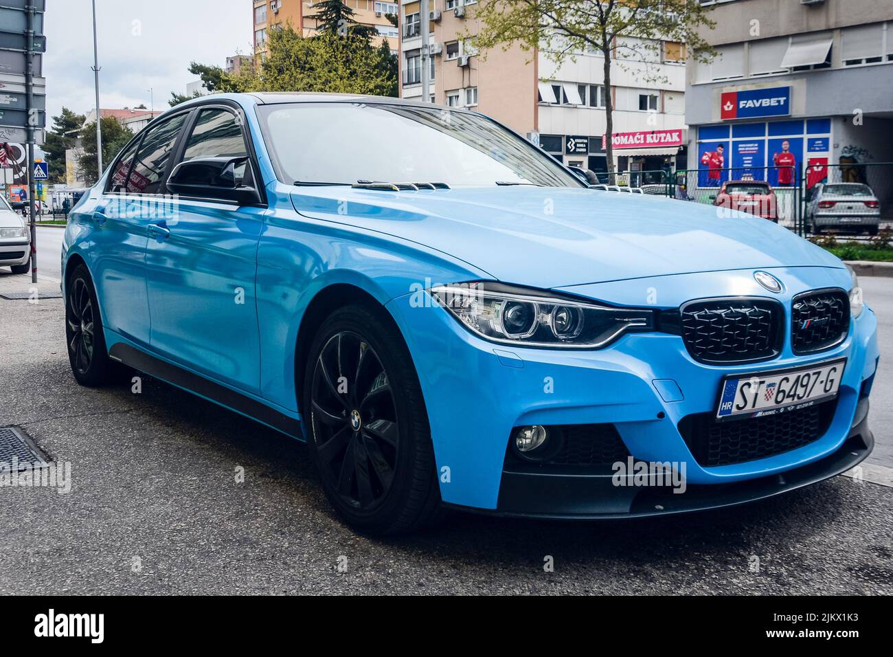 A blue BMW on the street Stock Photo Alamy