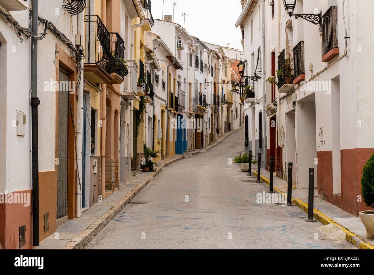 A beautiful shot of a narrow alley between old residential buildings ...
