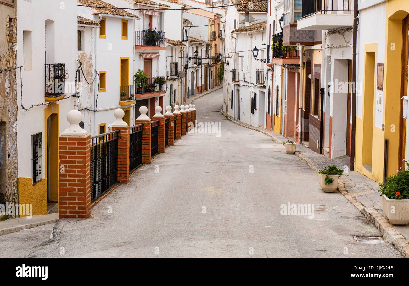 A beautiful shot of a narrow alley between old residential buildings ...