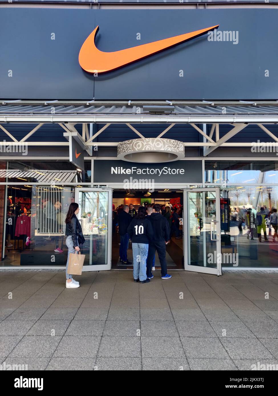 The front of a Nike Factory store in an outlet shopping center in Germany Stock Photo