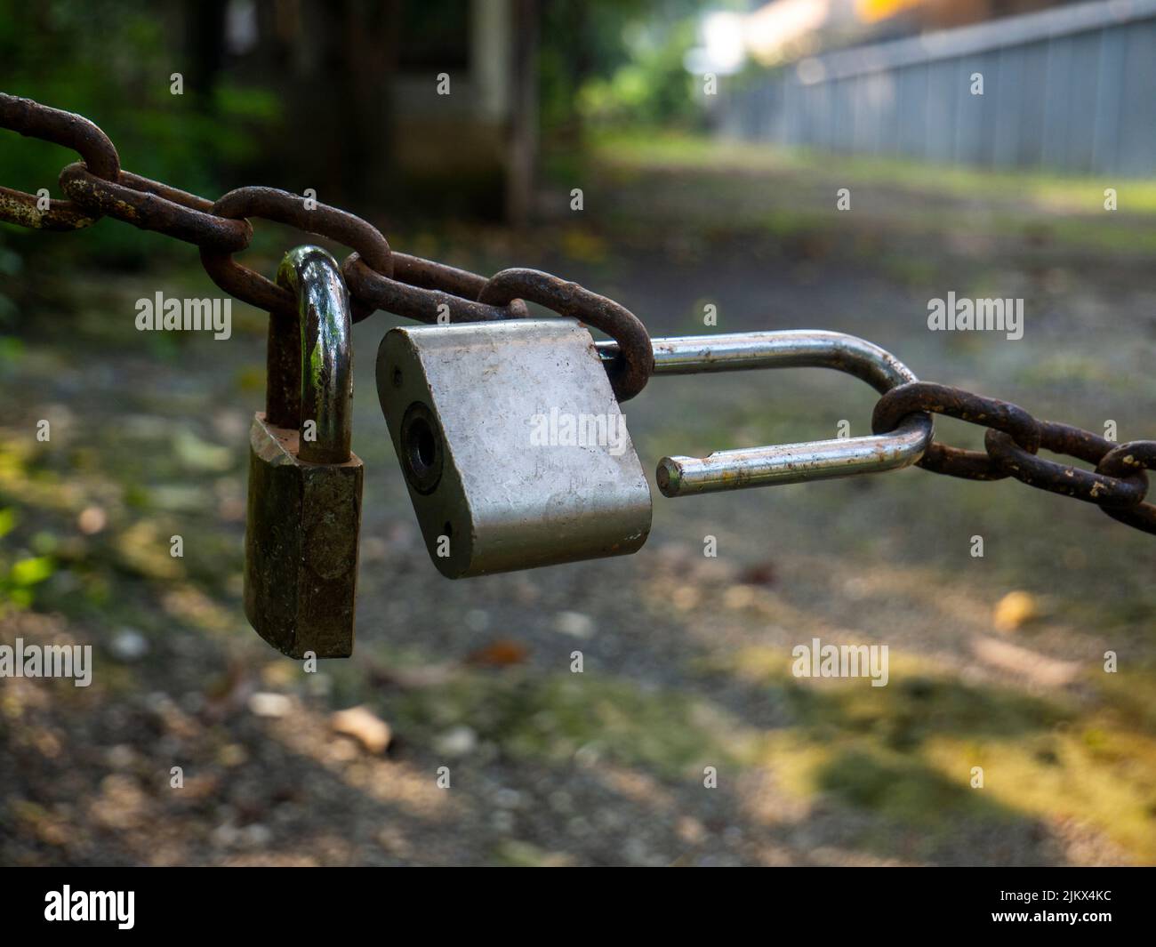 Rusty chain with an open padlock, Rusty chain with padlock Stock Photo
