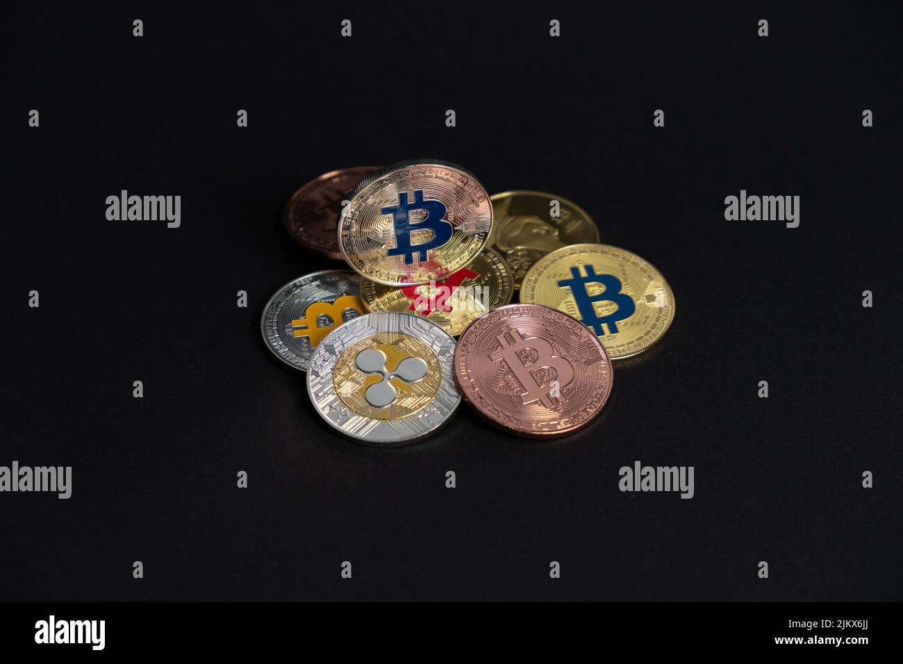 Bitcoin silver coin standing on many digital coins, in a grey background. Bitcoin - BTC Bit Coin - Crypto currency. Stock Photo