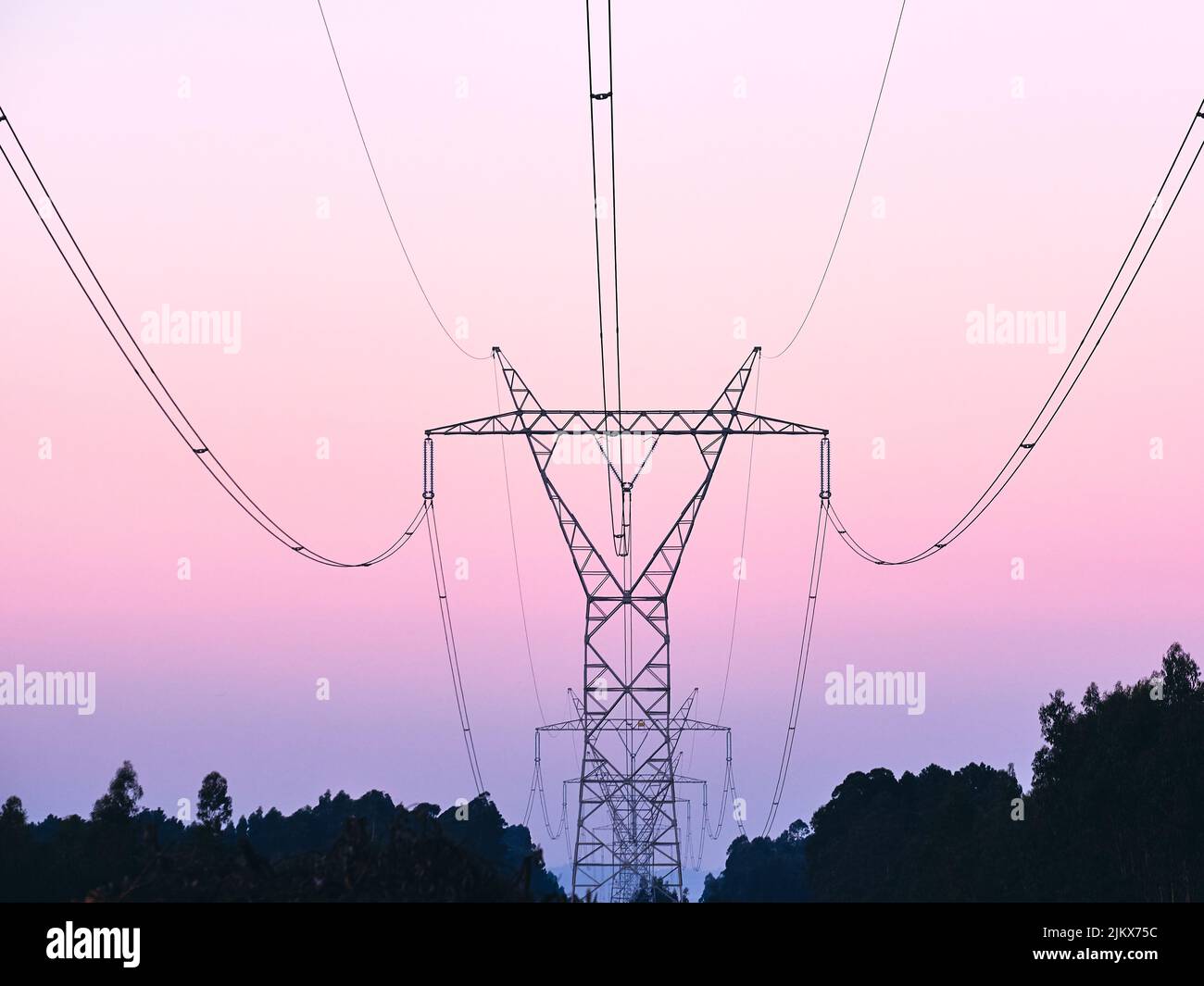 The silhouettes of transmission towers at sunset Stock Photo - Alamy