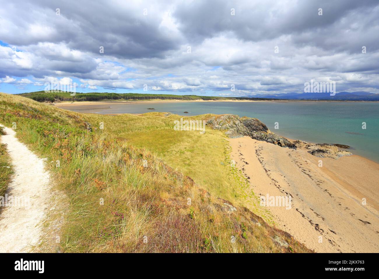 Newborough Forest and Llanddwyn Bay from Llanddwyn Island, Ynys LLanddwyn, Isle of Anglesey, Ynys Mon, North Wales, UK. Stock Photo