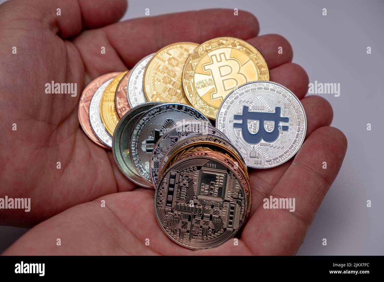 Coins bitcoin, the money lies, on the bill table of 50 dollars. The  banknotes are spread on the table in a free order of 50 dollars. Gold coins  are cr Stock Photo - Alamy