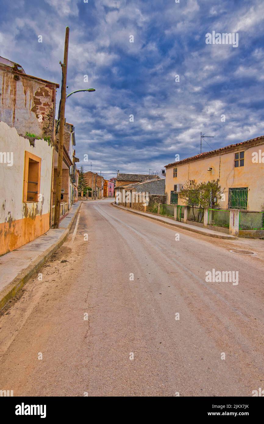 A vertical shot of the empty road with old Spanish houses. Cuenca, Spain. Stock Photo