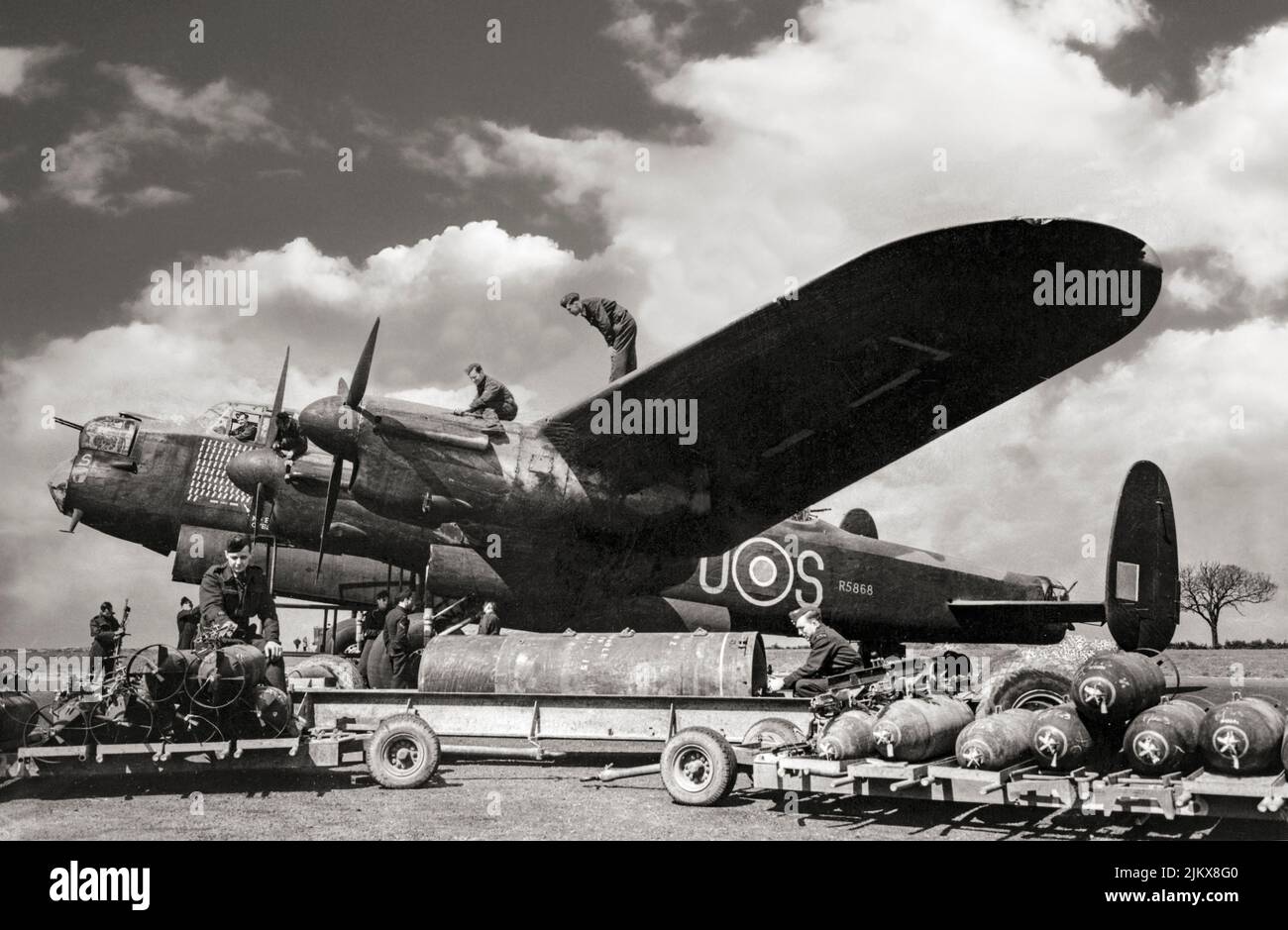 The veteran Avro Lancaster bomber 'S for Sugar', of No 467 Squadron, Royal Australian Air Force, is prepared for its 97th operational sortie at RAF Waddington, Lincolnshire, England. The 'Lancs' first saw service with RAF Bomber Command in 1942 and as the strategic bombing offensive over Europe gathered momentum, it became the main aircraft for the night-time bombing campaigns that followed. Stock Photo
