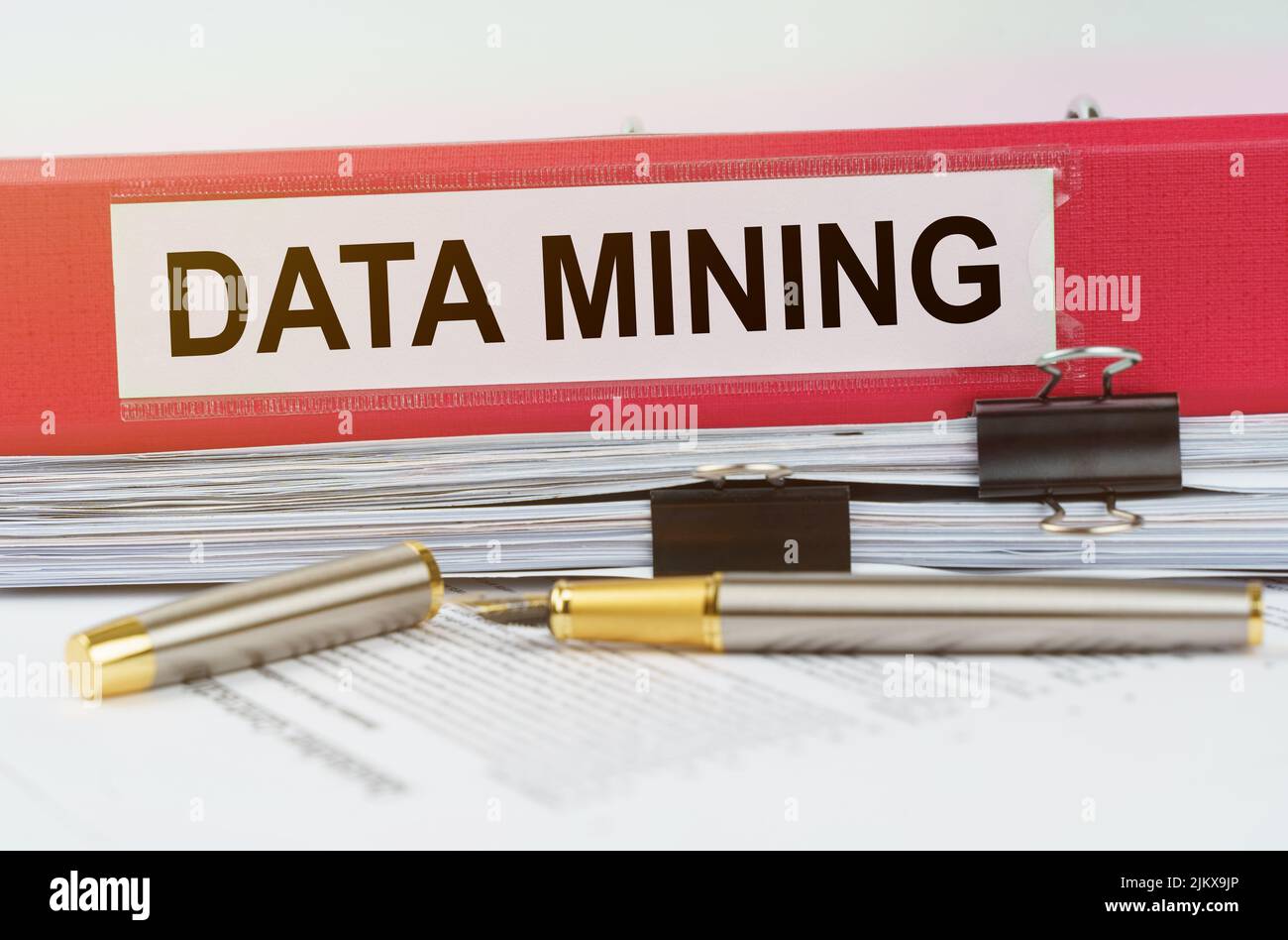 Business and economy concept. There is a folder on the documents with the inscription - DATA MINING Stock Photo