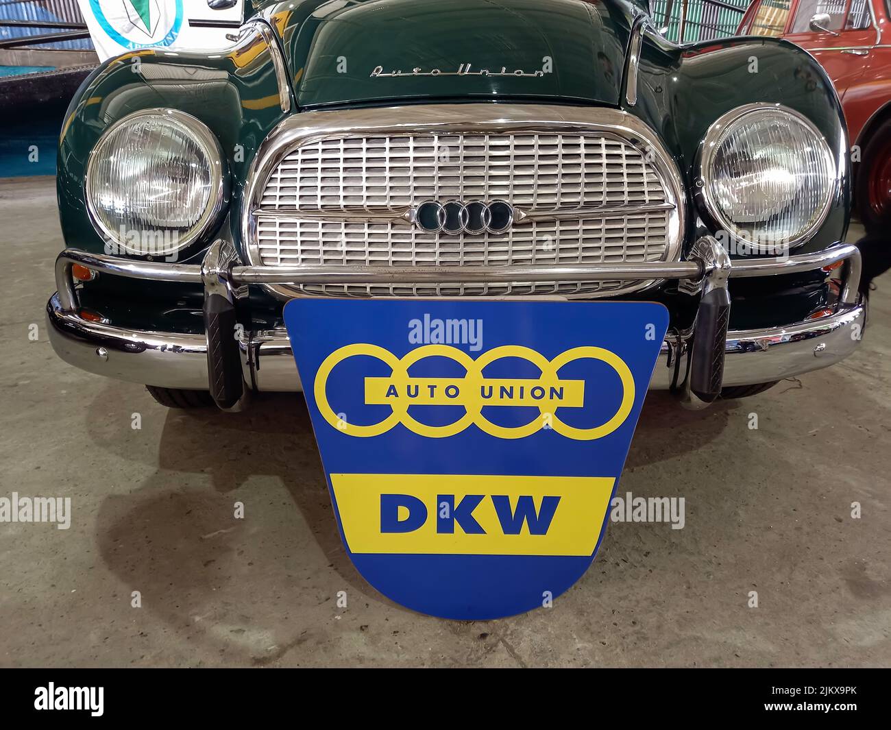 Avellaneda, Argentina - Apr 3, 2022: old blue and yellow Auto Union sign emblem logo and branding on the grille of a DKW 1000 S sedan 1960s. Stock Photo