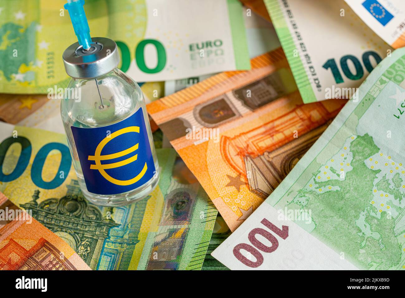 Vaccine price, cost or capital injection concept - glass vial and eur ...