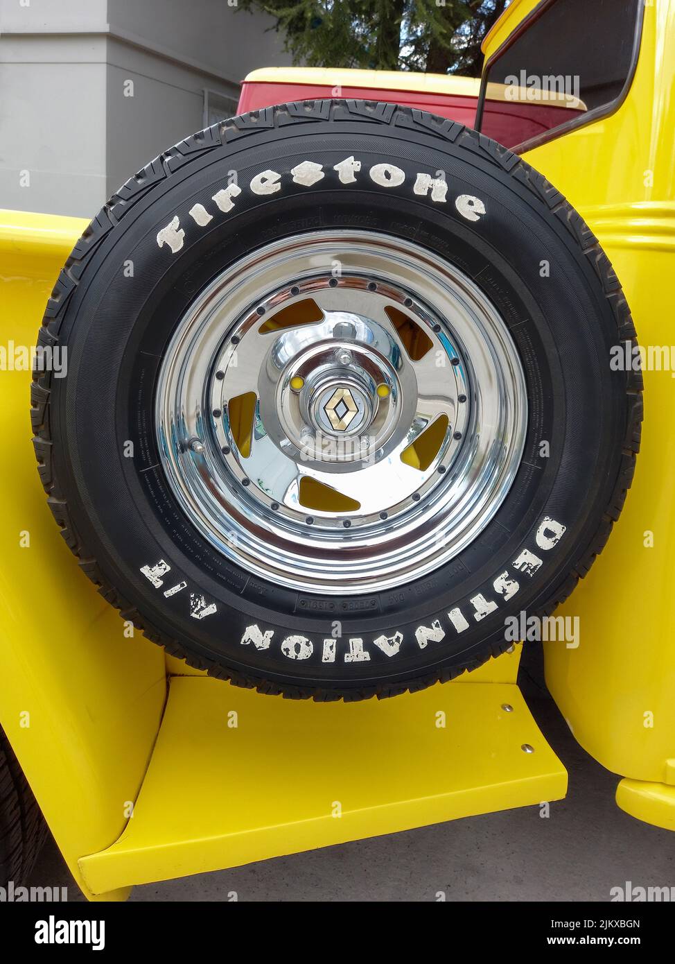 Avellaneda, Argentina - Apr 03, 2022: Firestone logo and brand on rubber tire. Spare wheel at the side of the bed of an old pickup truck. Traditional Stock Photo