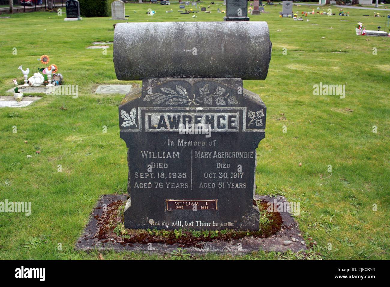 An Old tombstones of Lawrence in green land in Langley cemetery, British Columbia, Cana Stock Photo