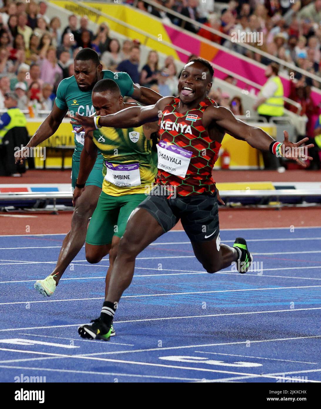 Commonwealth Games - Athletics - Men's 100m - Final - Alexander Stadium, Birmingham, Britain - August 3, 2022 Kenya's Ferdinand Omanyala celebrates as he crosses the line to win the gold medal ahead of silver medallist South Africa's Akani Simbine REUTERS/Phil Noble Stock Photo