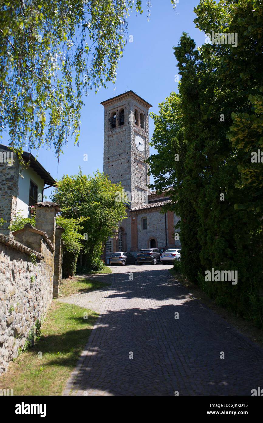 Street view of the bell tower of Santa Maria and San Giorgio church in Fortunago, one of the most charming villages of Oltrepò Pavese, Lombardia count Stock Photo