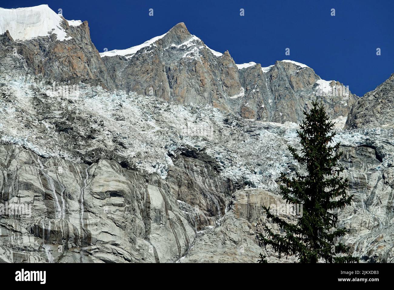 Climate change. View of the Brenva glacier melting creating large waterfalls. Courmayeur, Italy Stock Photo