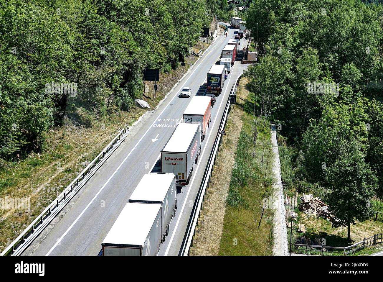 Long queue of vehicles at the entrance to the Mont Blanc Tunnel. Courmayeur, Italy - August 2022 Stock Photo