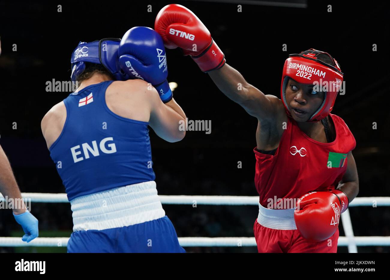Zambia's Margret Tembo on top during her defeat to England's Demie-Jade Resztan (blue) during the Women’s during the Women’s 45kg-48kg Quarter Final 4 at The NEC on day six of the 2022 Commonwealth Games in Birmingham. Picture date: Wednesday August 3, 2022. Stock Photo