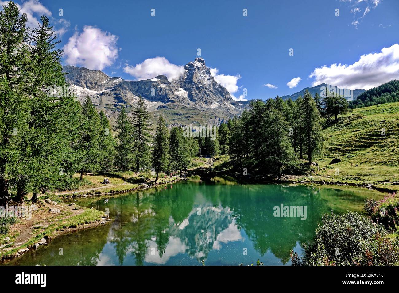 Summer alpine landscape with the Matterhorn (Cervino) reflected on the Blue Lake (Lago Blu) near Breuil-Cervinia. Aosta Valley, Italy - August 2022 Stock Photo