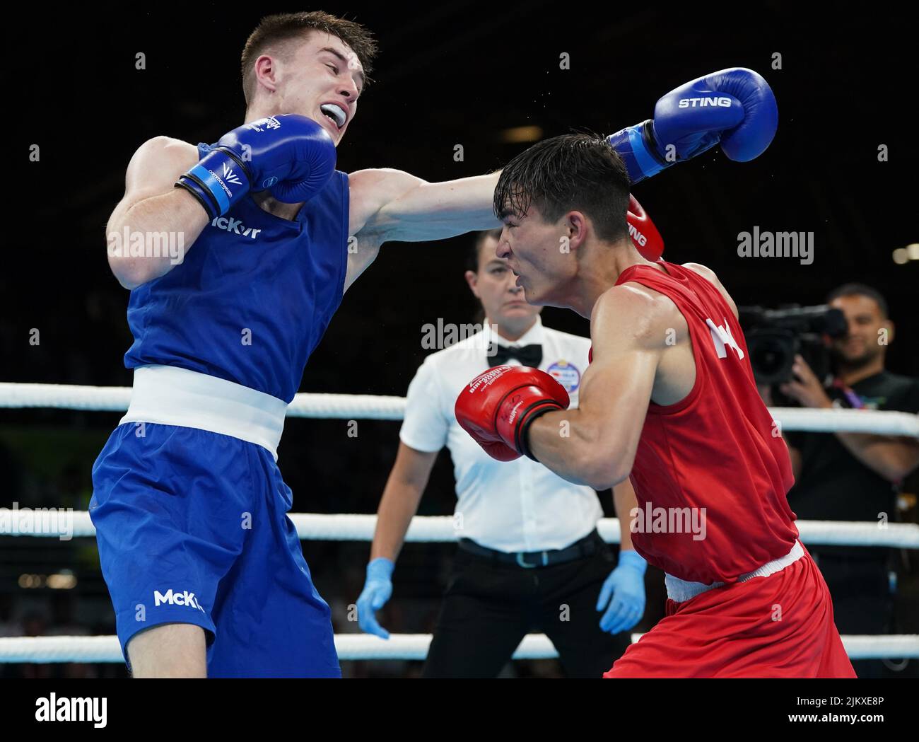 Pakistan's Ilyas Hussain and Northern Ireland's Jude Gallagher(blue) during the Men’s 54kg- 57kg (Featherweight) - Quarter-Final 3 at The NEC on day six of the 2022 Commonwealth Games in Birmingham. Picture date: Wednesday August 3, 2022. Stock Photo
