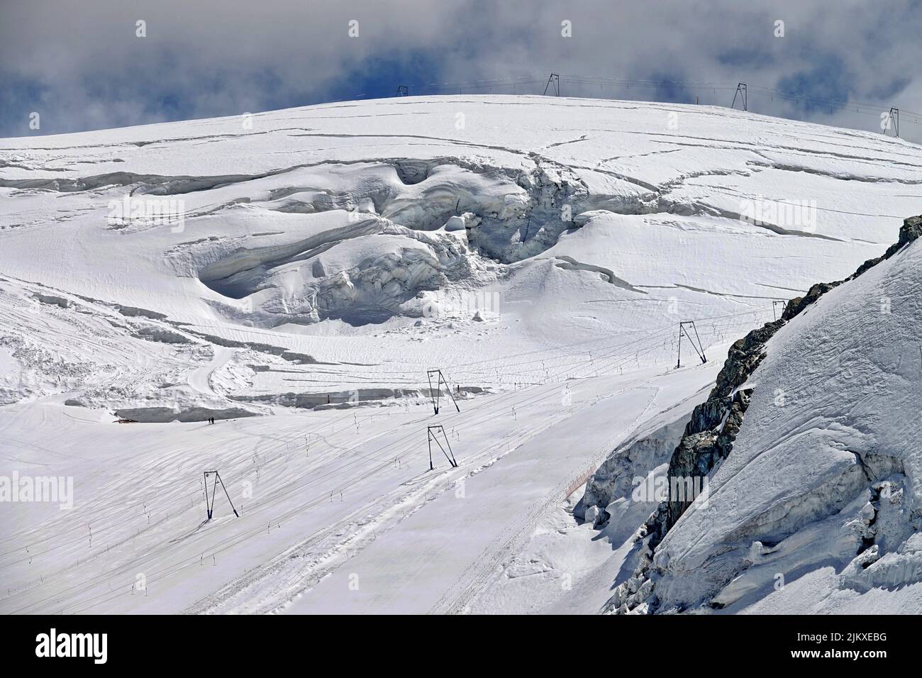 Plateau Rosà glacier, the effects of climate change are evident. Due to little snow and high temperatures at altitude stop summer skiing.  Breuil-Cerv Stock Photo