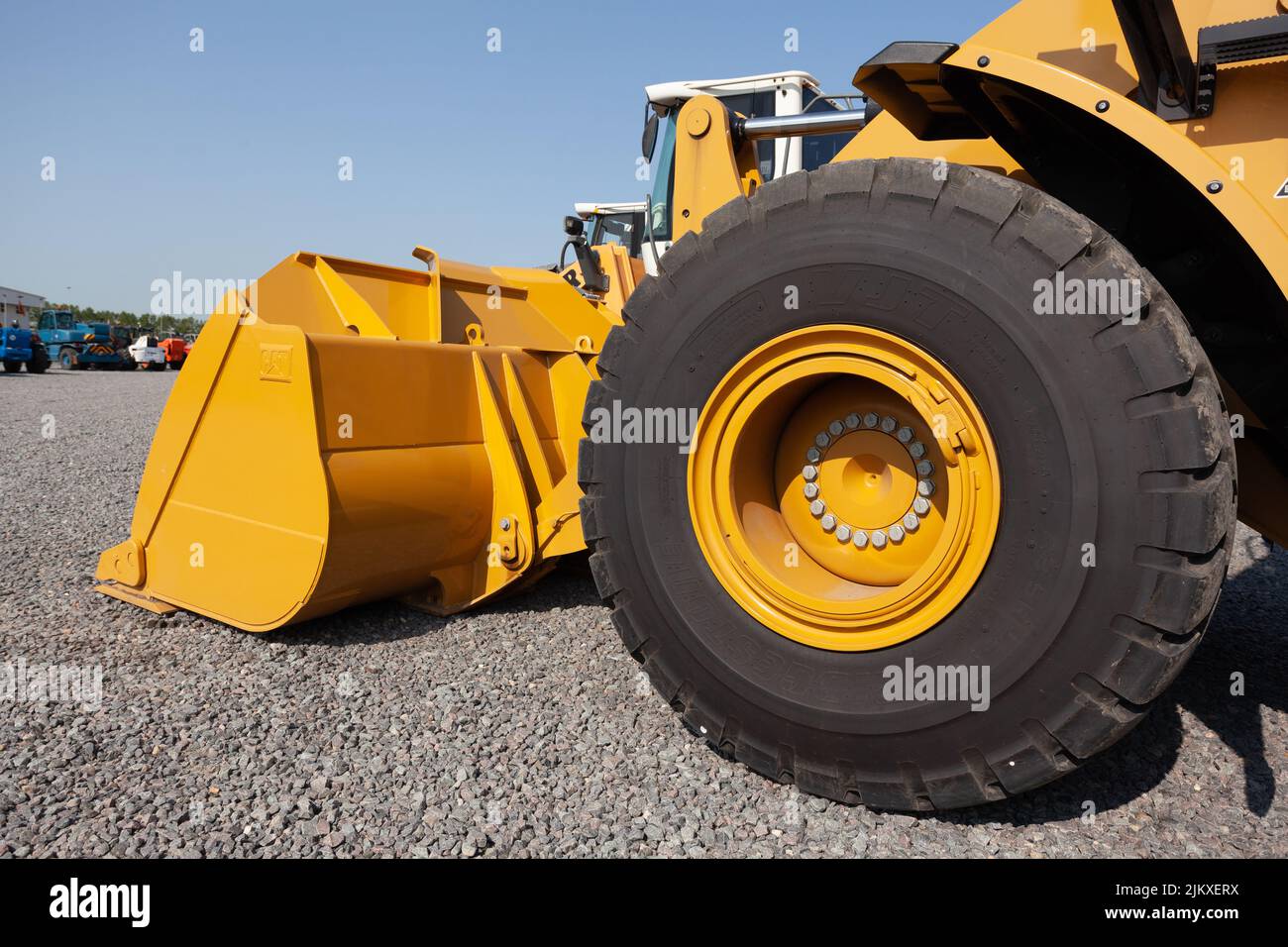 The blade and front wheel of a bulldozer Stock Photo Alamy